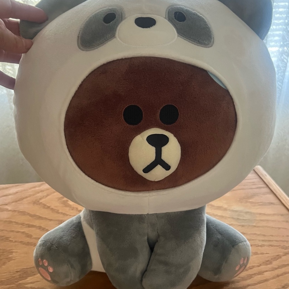Bear dressed as a panda plushie.
